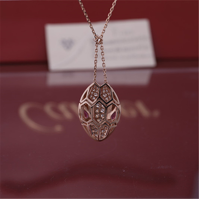 Roman Serpenti necklace in 18 kt rose gold set with rubellite eyes and with pavé diamonds on the head