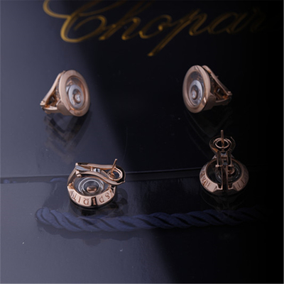 Ευτυχή σκουλαρίκια πνευμάτων Chopard στον ηθικό ροδαλό χρυσό ηθικό άσπρο χρυσό με τα διαμάντια